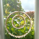 Handmade suncatcher with hoops, beads, a clear glass prism and chain