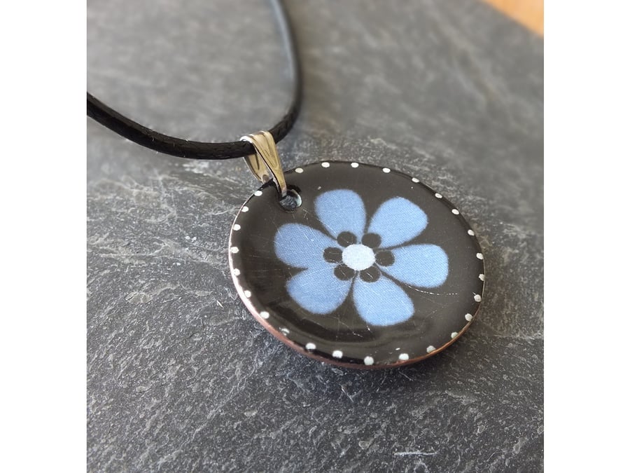 Blue flower on black background - pendant