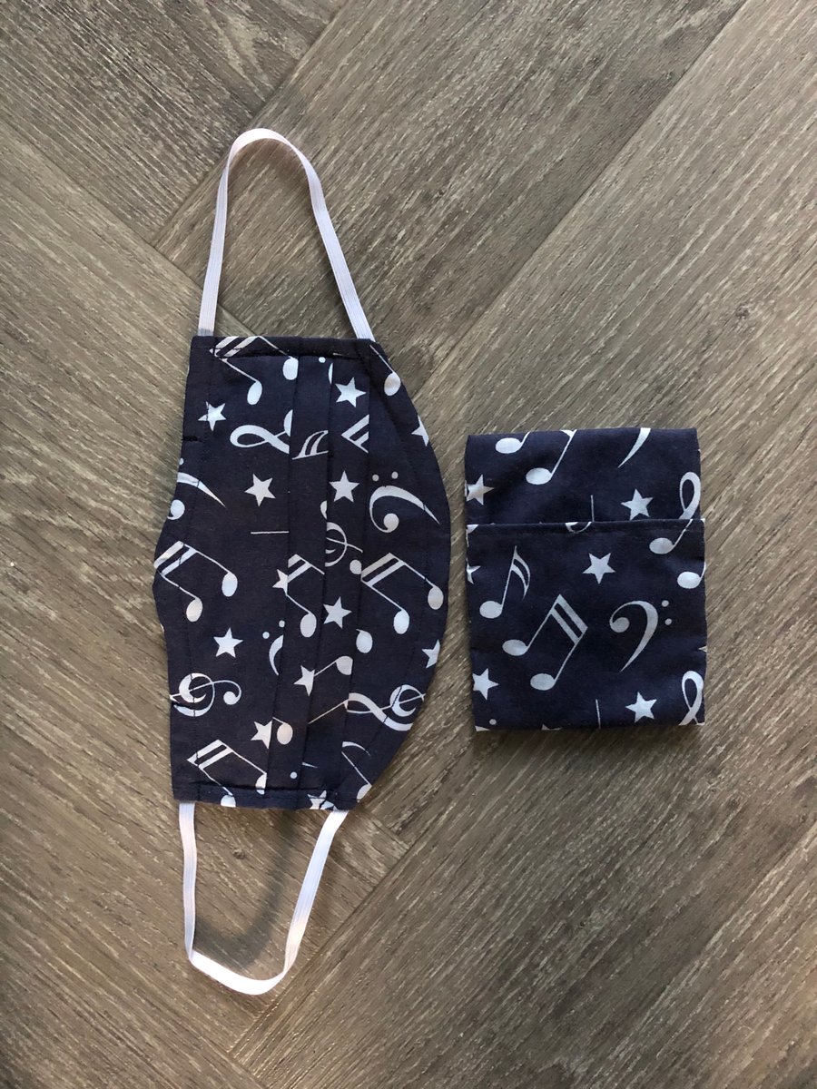 Washable face covering with filter with bag