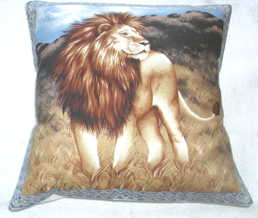 On Safari Magnificent Lion standing on the dry grassy plain cushion