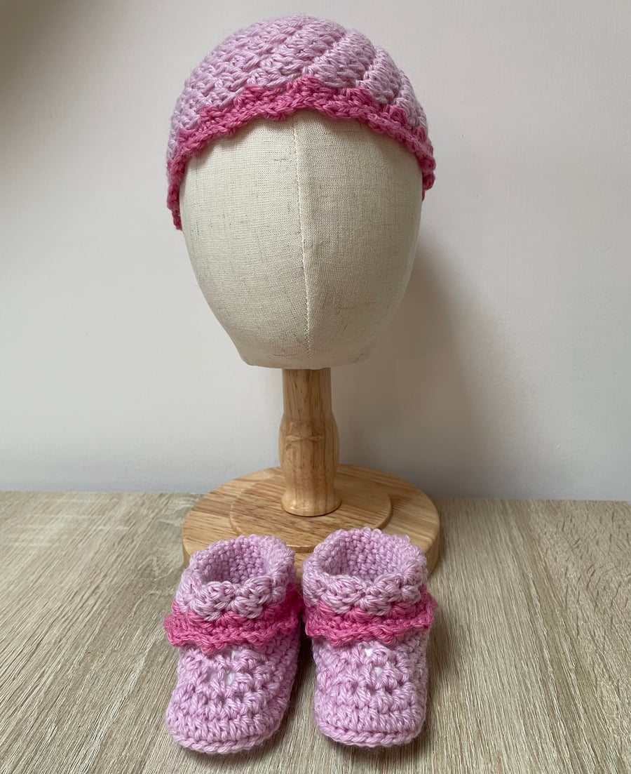 Pink baby hat and bootie set.