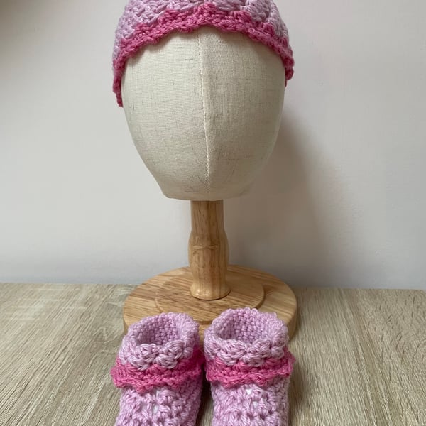 Pink baby hat and bootie set.