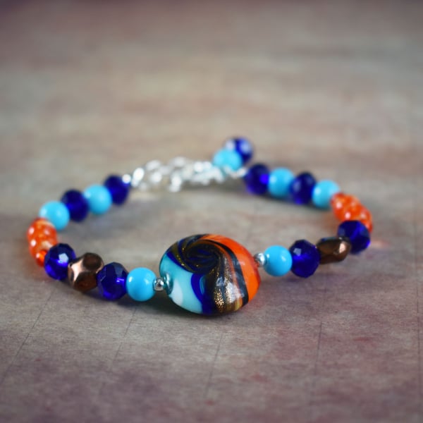 Multicoloured Beaded Bracelet with Focal Blue, Orange and Brown Lampwork Bead