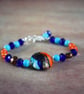 Multicoloured Beaded Bracelet with Focal Blue, Orange and Brown Lampwork Bead