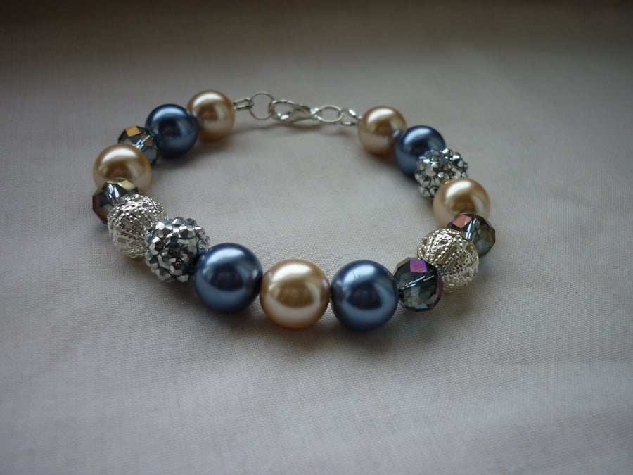 BLUE, CREAM AND SILVER BRACELET.  812