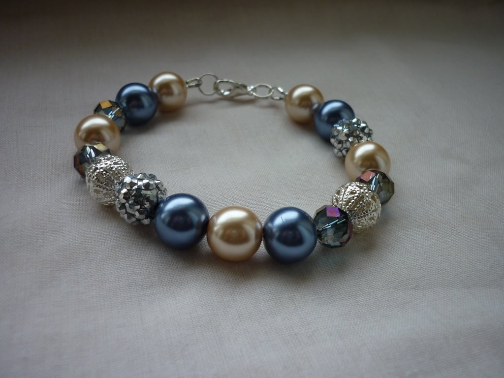 BLUE, CREAM AND SILVER BRACELET.  812