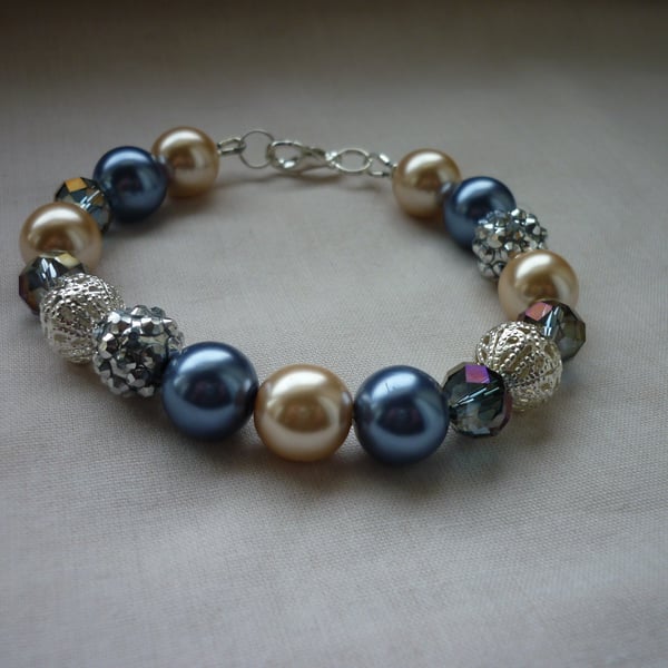 BLUE, CREAM AND SILVER BRACELET.  812