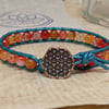 Orange agate and teal leather bracelet with circle of life button fastener