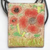 large oblong pendant on thong - poppies