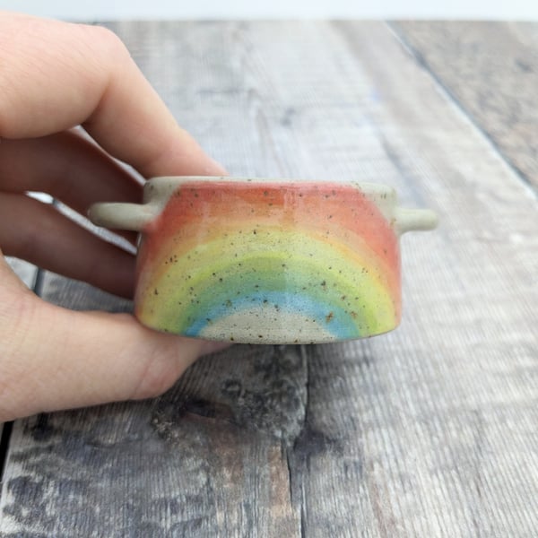 Speckled ceramic tealight holder with rainbow design