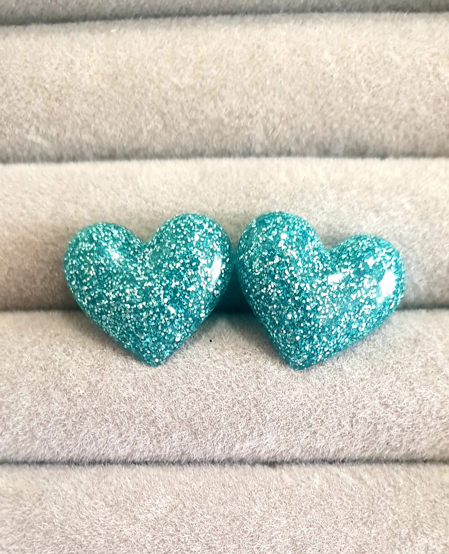 Large pale blue glitter heart stud earrings