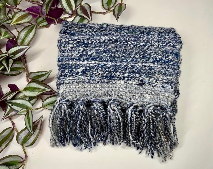 Hand spun Knitted scarf made with a mix of blended fibres.