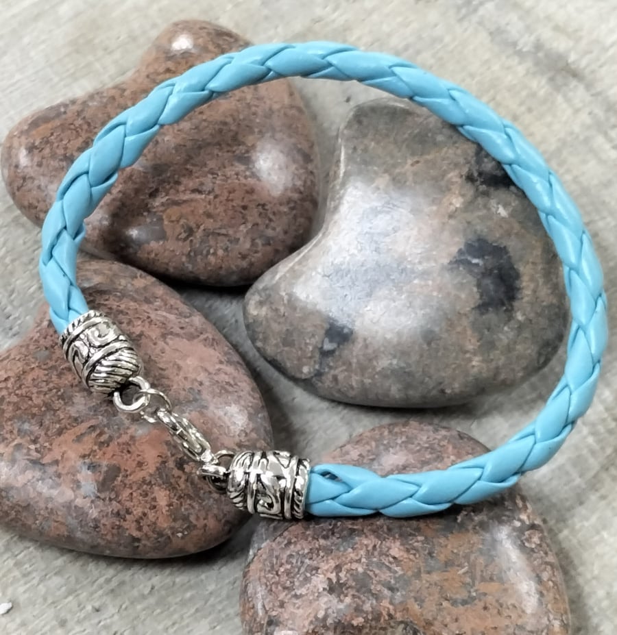 Pale blue plated leather bracelet with ornate ends