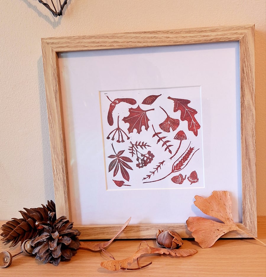 An original handprinted linoprint of autumn leaves  titled 'Blustery'