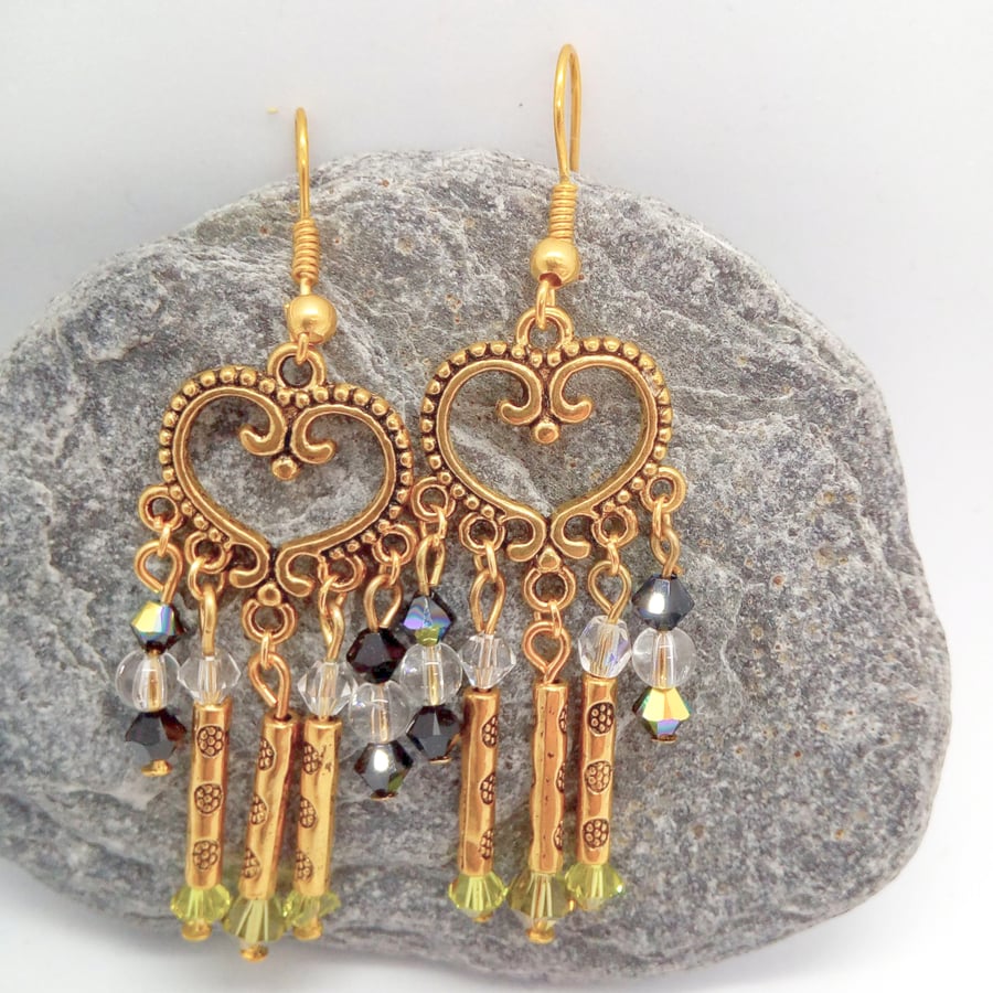 Earrings made with Black Clear and Green Crystals and Gold Plated Tube Beads