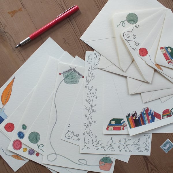 Illustrated letter paper and envelopes with a mix of original designs