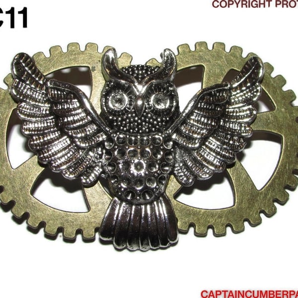 Silver owl on bronze cogs DC11