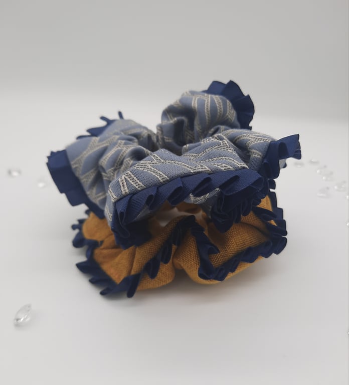 Scrunchies with a navy ribbon edge, in blue and mustard 