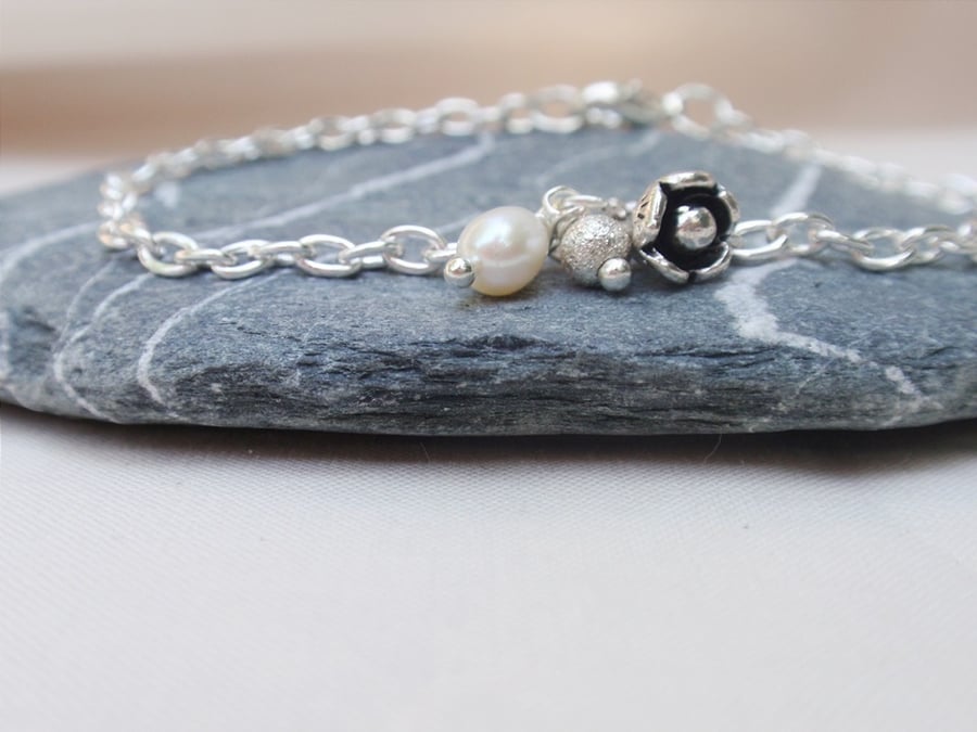 Silver plated charm bracelet with flower and freshwater pearl, silver bracelet