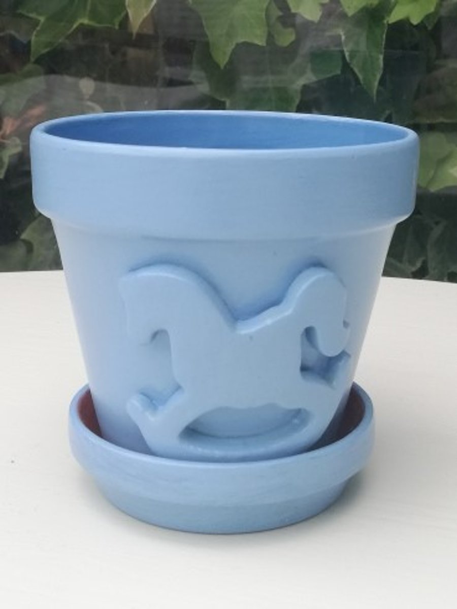 Blue rocking horse flowerpot