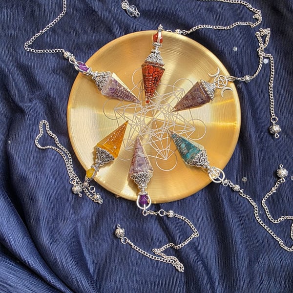 Gaze upon these exquisite crystal pendulums, each a marvel of nature's artistry