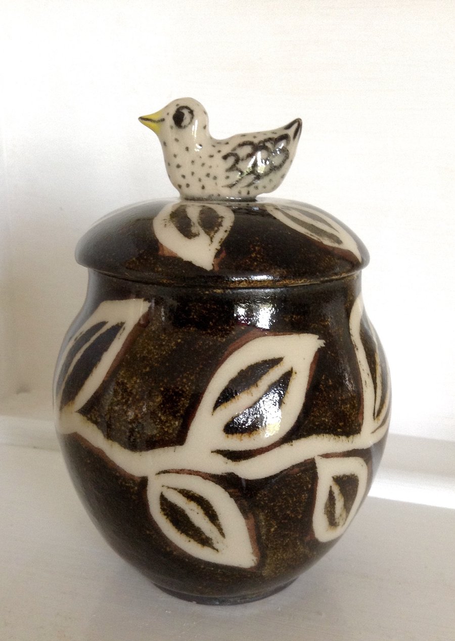 Stoneware storage jar with bird lid