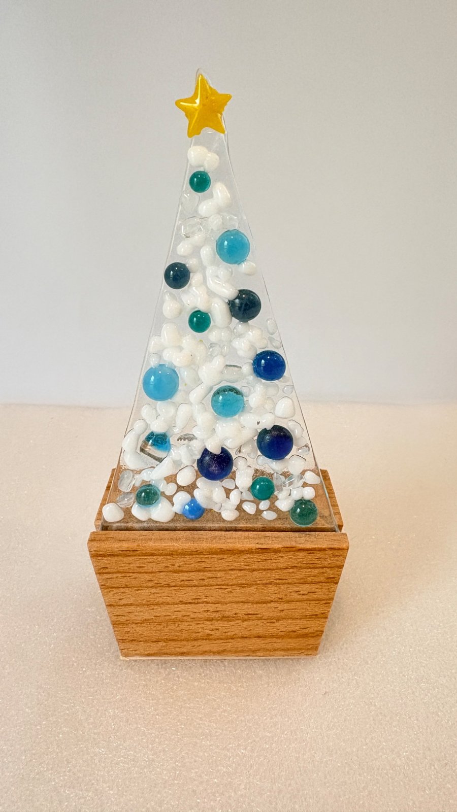 White and blue fused glass Christmas tree in oak base 