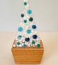 White and blue fused glass Christmas tree in oak base 