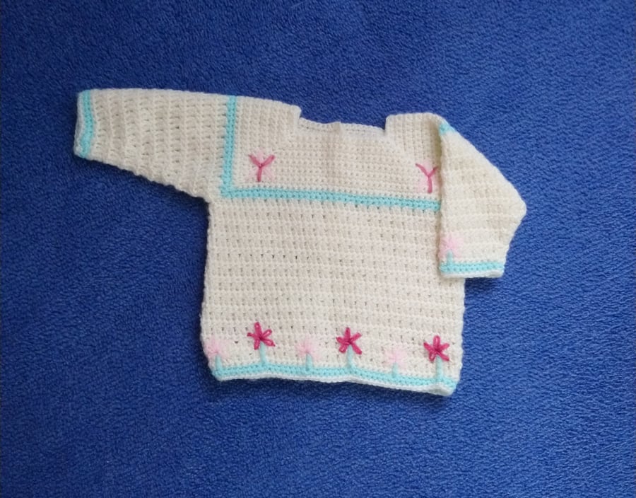 Unique Crochet Baby jumper in soft cream yarn with pink embroidered flowers