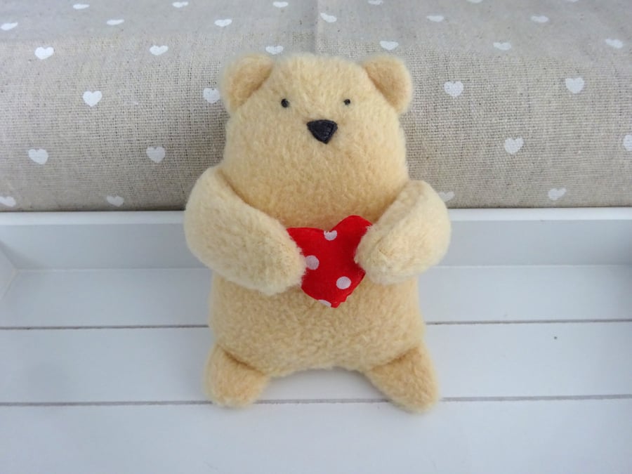 hand stitched bear with red heart