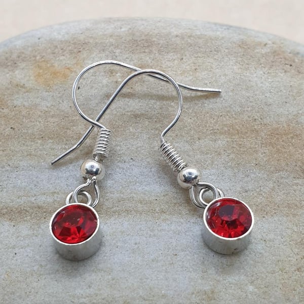 sweet little silver plated earrings with mini red glass pendants