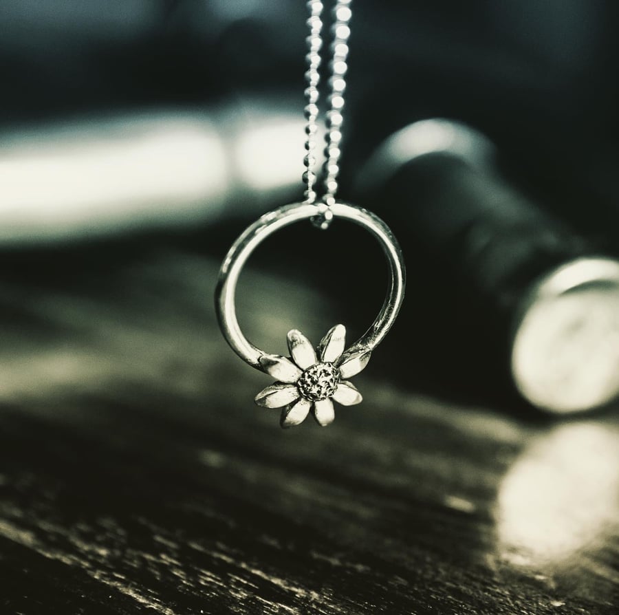 The silver sunflower pendant 