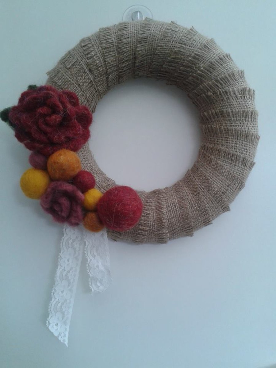 Red and gold felt and hessian decorative wreath