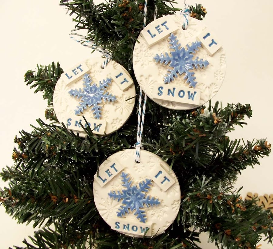 Set of three Let It Snow ceramic decorations