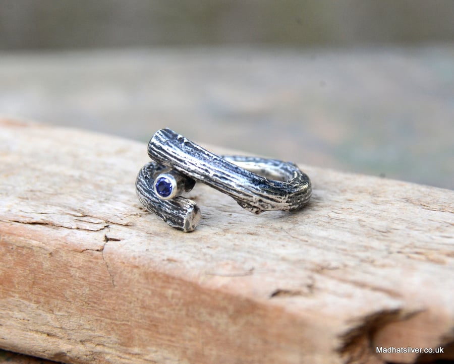 Textured silver twig ring with blue stone