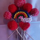 Pom pom bouquet 1x large 5x medium, heart, rainbow. Will be wrapped in tissue