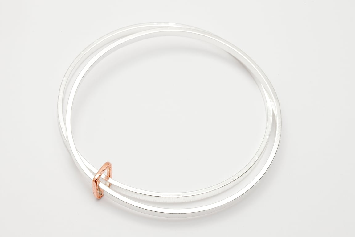 Loja by Fedha - stylish pair of silver bangles with yellow gold link