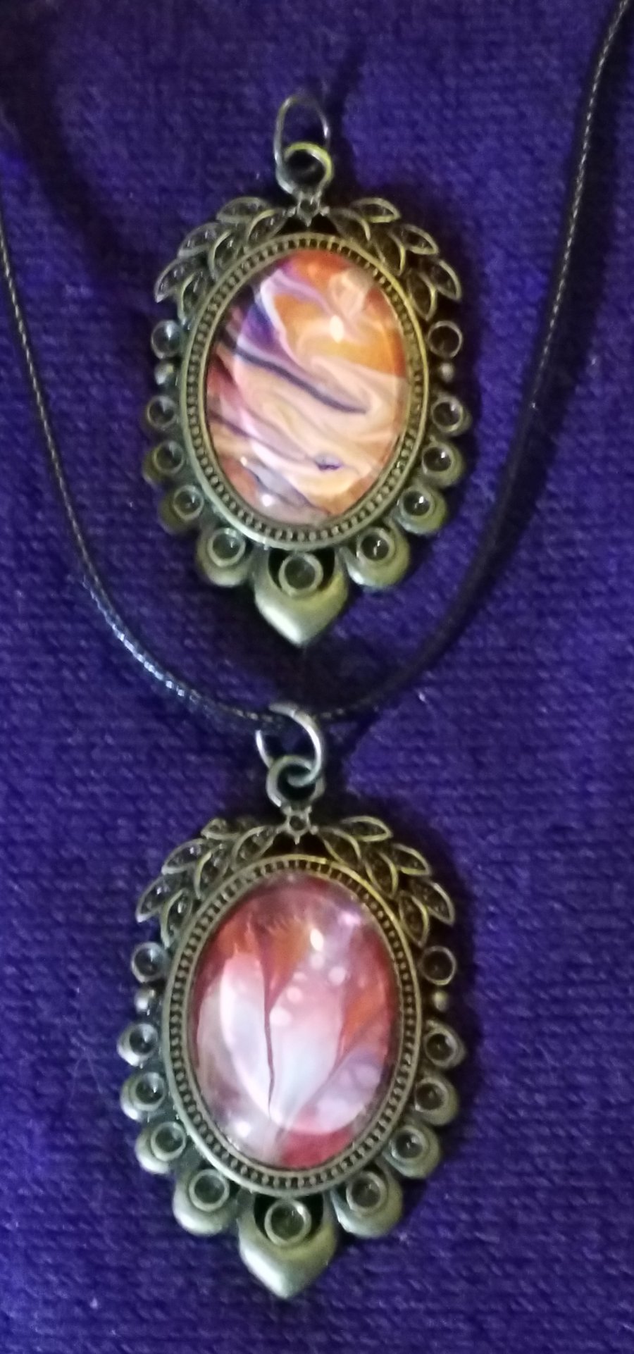 2 for 1 handmade fluid art pendants. Red, orange, white and purple