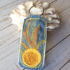 Up cycled sun embroidered keyring.