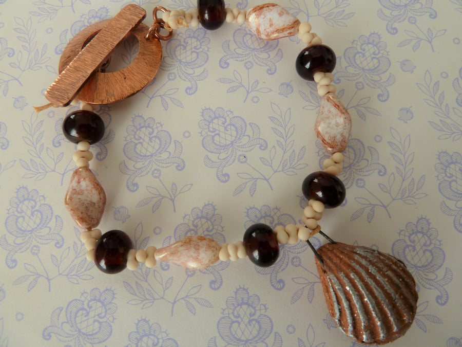 copper, lampwork and ceramic shell bracelet