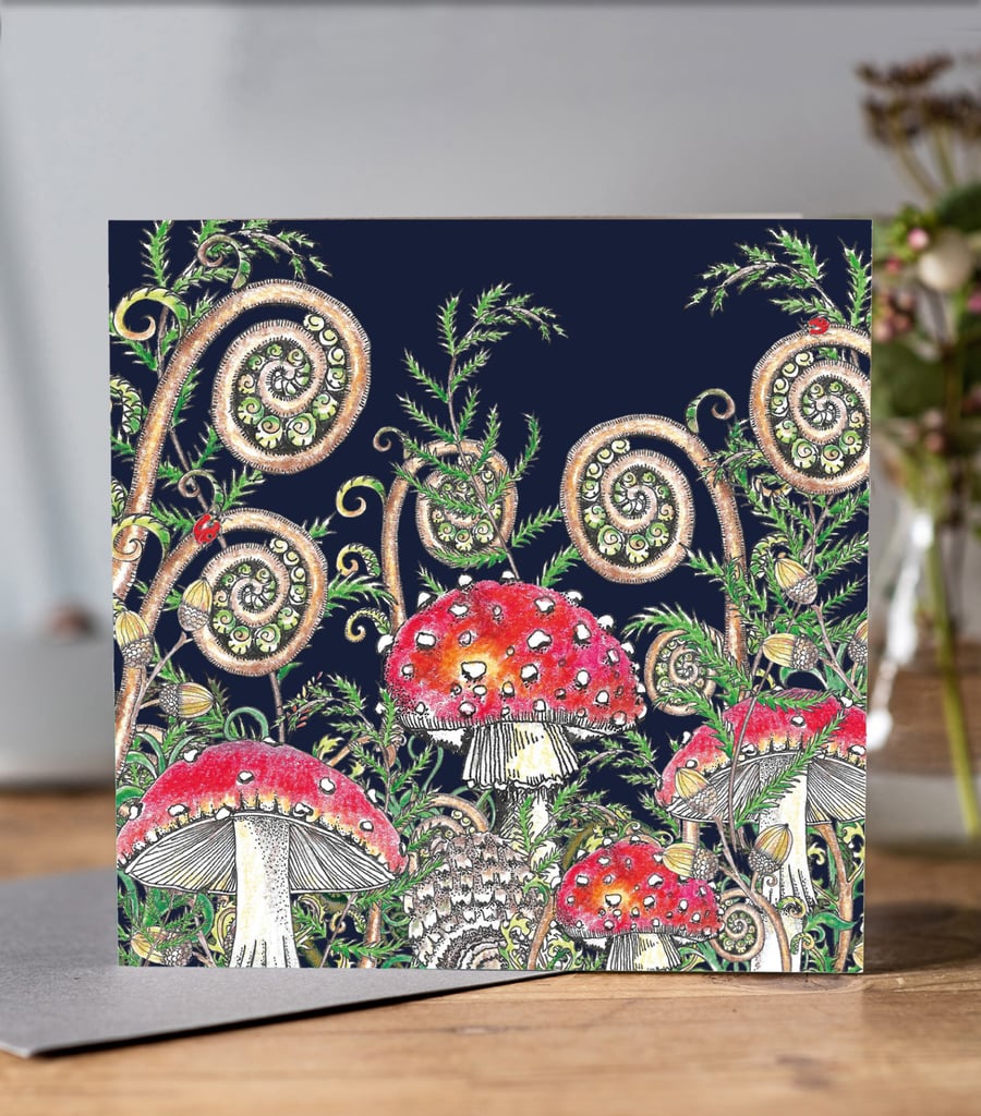 Toadstool greeting card with dark blue background 