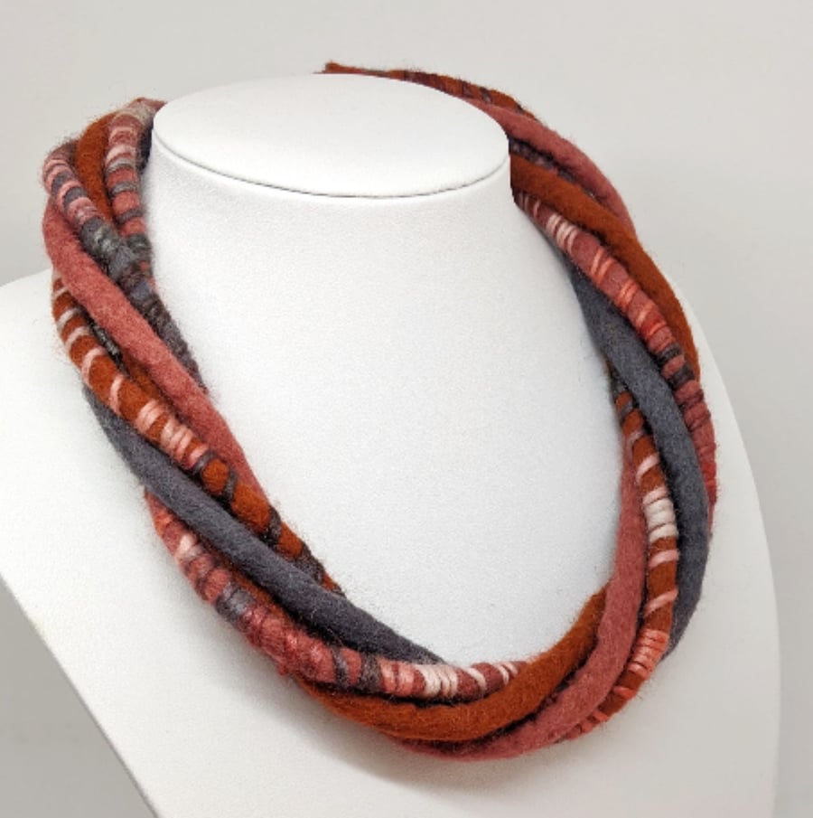 The Wrapped Twist: felted cord necklace in shades of rusty oranges and grey