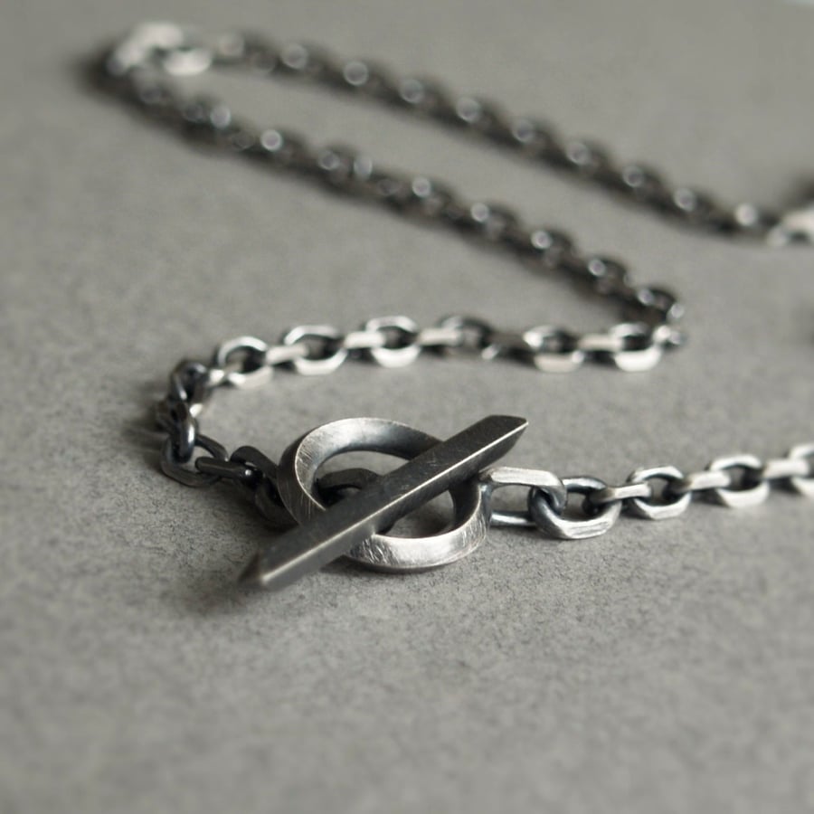 Oxidised or polished solid silver diamond cut trace chain with a unique t-bar
