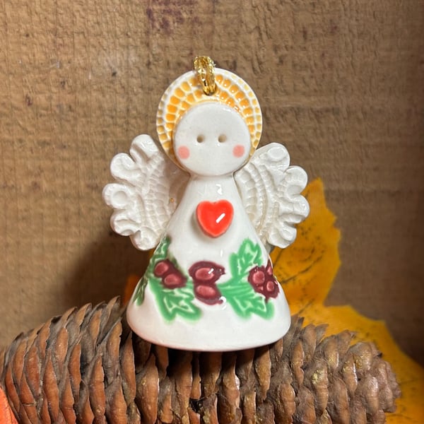 Teeny little ceramic angel with berry details