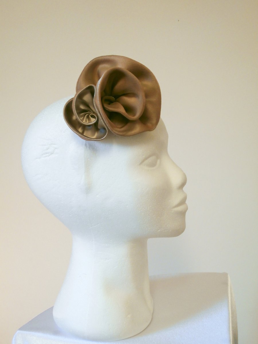 Handmade hair decoration. Brown silk rosettes on a hair slide