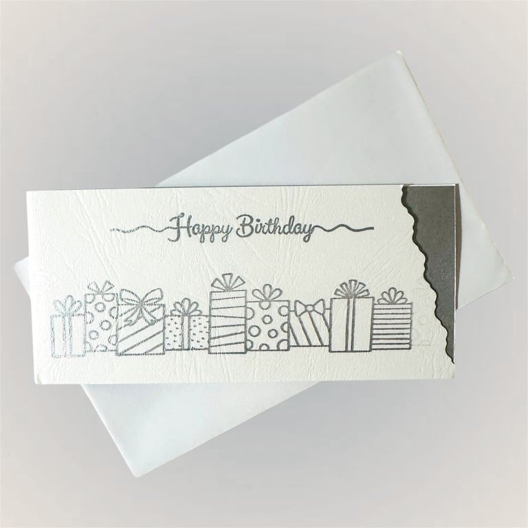 Luxury birthday card with silver presents, cutaway and matching shiny insert. 
