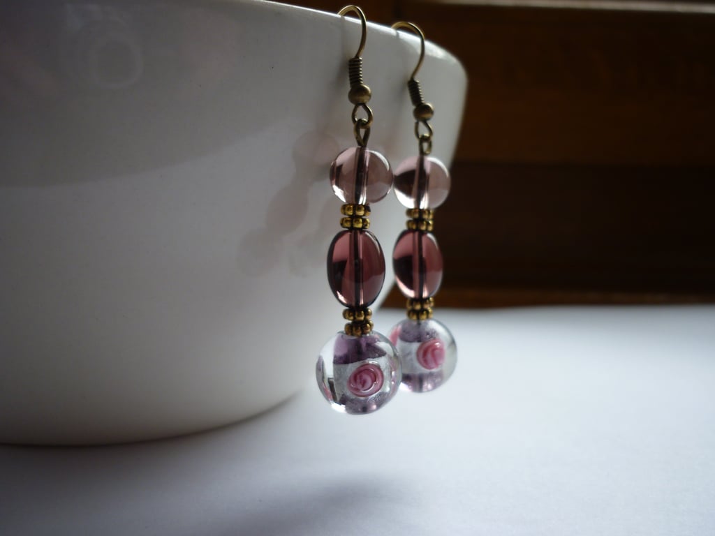 AMETHYST, PINK, SILVER AND BRONZE LAMPWORK BEAD EARRINGS.