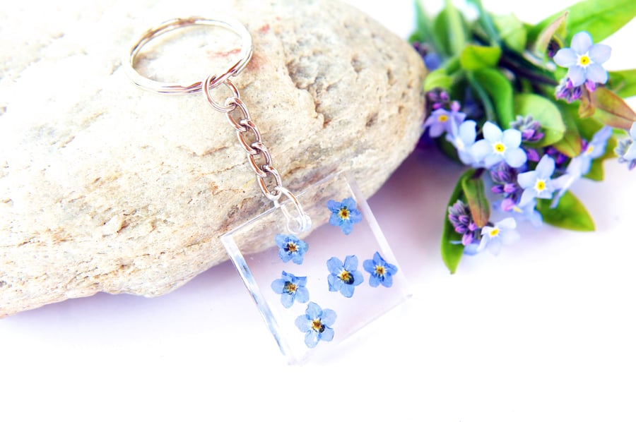 nature inspired resin keyring with pressed forget me not flowers