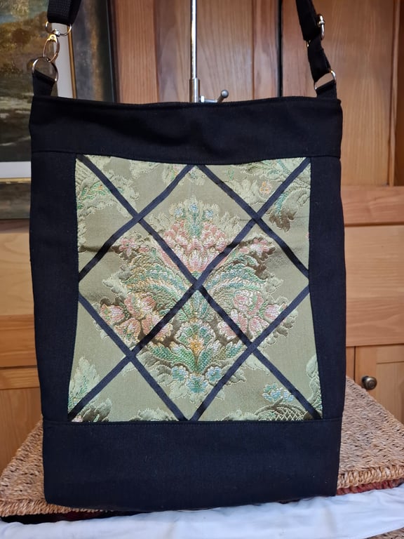 Black denim and green brocade bag