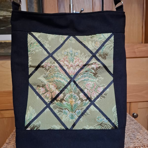 Black denim and green brocade bag